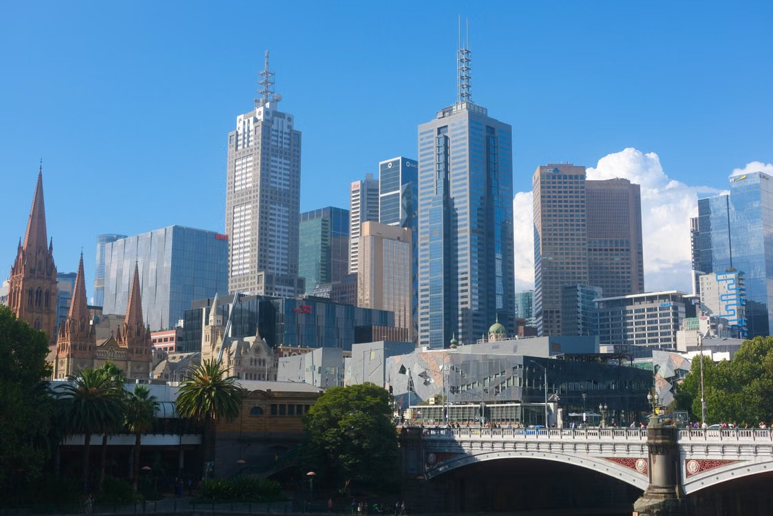 Melbourne CBD skyline with skyscrapers, historic St Paul's Cathedral and Princes Bridge over the Yarra River — Commercial Property Loan Melbourne by Be Smart Finance